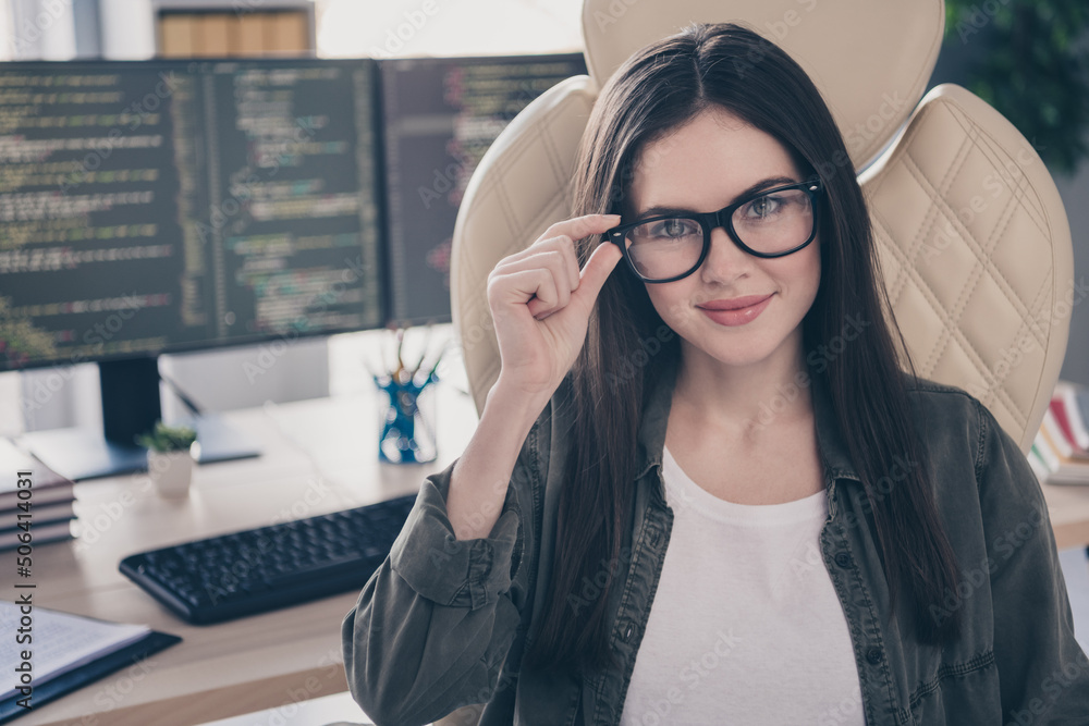 Poster portrait of attractive cheerful experienced girl developing web data startup touching specs at workp