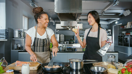 TV Cooking Show Kitchen with Two Master Chefs. Two Female Presenters Teach How to Cook Food....