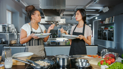 TV Cooking Show Kitchen with Two Master Chefs. Asian and Black Female Presenters Talk on Camera, Teach How to Cook Food, Taste Delicious Dish and Celebrate with High-Five. Online Video Class