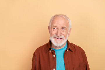 Photo of funky elder grey hairdo man look advert wear brown shirt isolated on beige color background