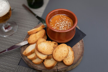 Example of a typical tapa of the local gastronomy, a terrine of melted cheese with honey and toasts