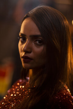 Close-Up Portrait of young woman at night 