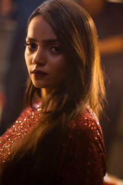 Close-Up Portrait of young woman at night 