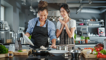 TV Cooking Show Kitchen with Two Master Chefs. Asian and Black Female Hosts Talk. Professionals Teach How to Cook Food, Taste Delicious Dish. Online Video Class Courses. Healthy Dish Recipe Prepare