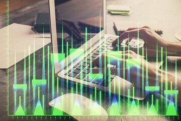 Obraz premium Double exposure of woman hands typing on computer and forex chart hologram drawing. Stock market invest concept.