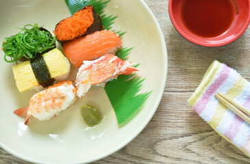 variety Sushi Japanese food with wasabi dipping soy sauce on white plate