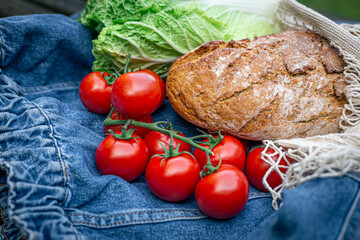 Vegetables and bread in a shopping bag, picnic concept.