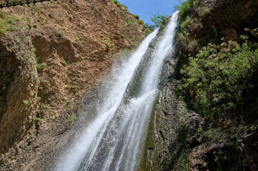Fototapeta premium Waterfall landscape. Ayun's fall water stream. River Nahal Ayun . Nature Reserve and National park. Upper Galilee, Israel