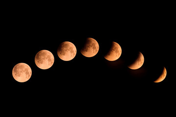 A composite image of the phases of a lunar eclipse over Corsica on 16th May 2022 - obrazy, fototapety, plakaty