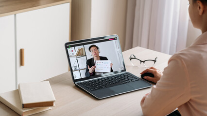 Home teleconference. Business webinar. Digital meeting. Woman watching male coach video...