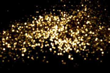 Golden blurred bokeh lights on black background. Glitter sparkle stars for celebrate. Overlay for...
