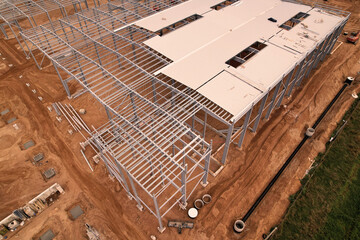Warehouse Construction from metal structure. Industrial building on light gauge steel framing....