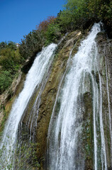 Fototapeta premium Waterfall landscape. Ayun's fall water stream. River Nahal Ayun . Nature Reserve and National park. Upper Galilee, Israel