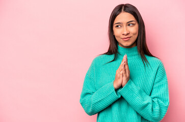 Young hispanic woman isolated on pink background making up plan in mind, setting up an idea.