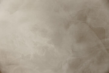 Naklejka premium Background beige textured. Abstract, waves, plaster, wallpaper