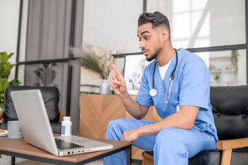 Qualified doctor conducting a virtual medical consultation