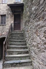 Fototapeta na wymiar old rock stairway to the house