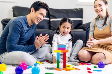 Portrait of enjoy happy love asian family father and mother with little asian girl smiling activity...