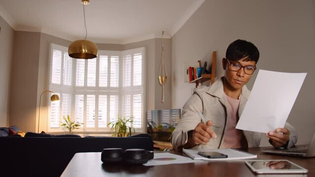 Asian young man taking notes