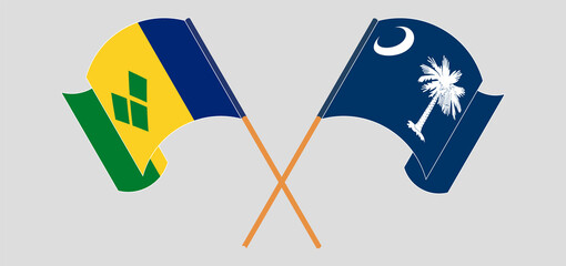 Crossed and waving flags of Saint Vincent and the Grenadines and The State of South Carolina