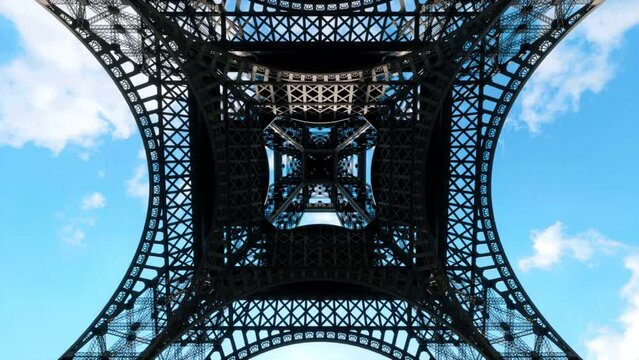 A view up through the center of the wrought-iron structure of the Eiffel Tower in Paris, France.