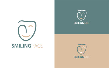 Smiling face logo in the shape of a tooth.