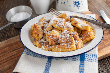 Kaiserschmarrn, Austrian pancake on a plate with powdered sugar