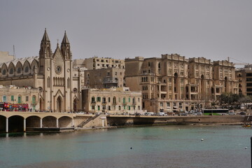 skyline of St Julians, Malta with the knisja tal-karmnu church on a sunny day