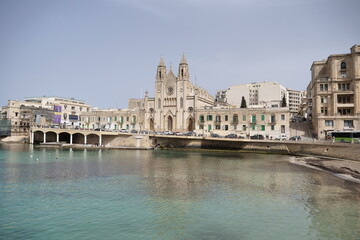Fototapeta na wymiar skyline of St Julians, Malta with the knisja tal-karmnu church on a sunny day