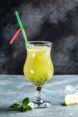 Kiwi drink, Summer cold drink with Kiwi Lime Mojito cocktail or non-allcohol mocktail. vertical image. top view. place for text