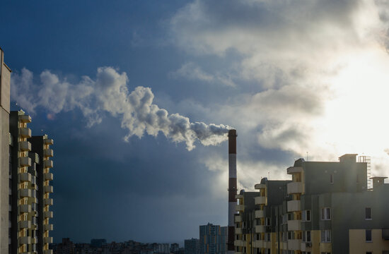Environmental problem of city air pollution - Industrial construction cranes and building site over Steam and smoke emissions. grunge filter photo