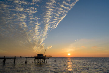 Fishing hut at sunset on west Atlantic coast of Charente Maritime, France
