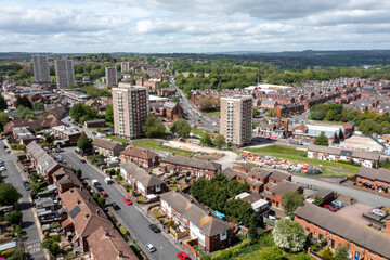 Fototapeta na wymiar Aerial photo of the town centre of Armley in Leeds West Yorkshire on a bright sunny summers day showing apartment blocks flats and main roads going in to the city centre of Leeds