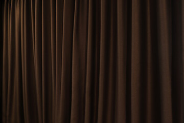 The background photo of dark golden brown color beautiful curtain in the dark luxury design bed room