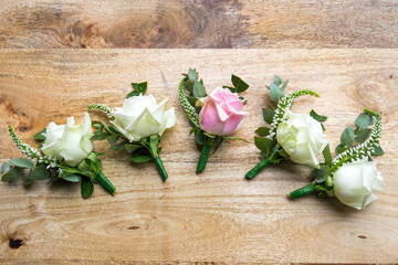 Floral buttonholes for the groom and his groomsmen