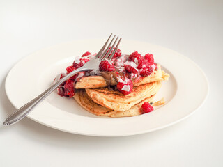 Raspberry and chocolate pancake stack