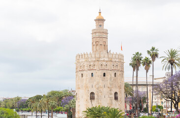 Fototapeta na wymiar The tourist Torre del Oro in Seville, next to the Guadalquivir river, Andalusia (Spain)