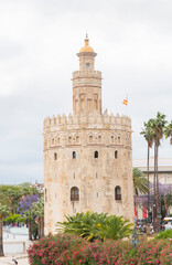 Fototapeta na wymiar The tourist Torre del Oro in Seville, next to the Guadalquivir river, Andalusia (Spain)