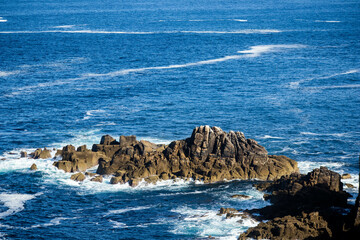 waves crashing on rocks