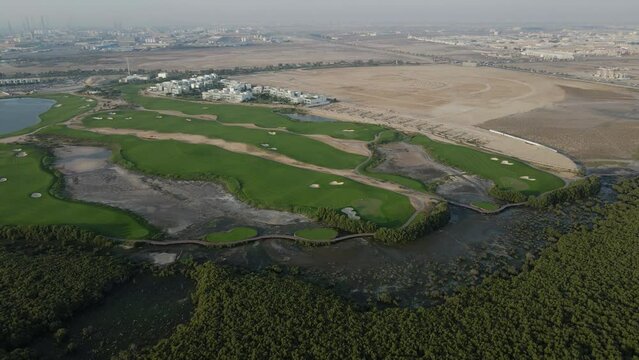 Top view of Ajman Mangroves and Golf course in the United Arab Emirates, 4k Footage