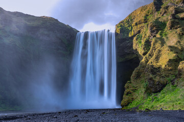 Skogafoss waterfall in Iceland at sunset