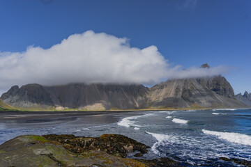 Vestrahorn mountain in Iceland and the waves of the sea