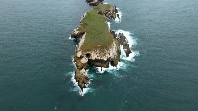 Aerial view of island Baleal naer Peniche on the shore of the ocean in west coast of Portugal. Baleal Portugal with incredible beach and surfers