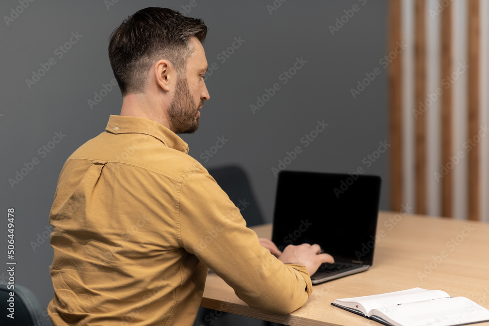 Poster Back View Of Businessman Working Using Laptop Computer In Office