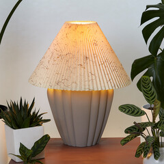 Vintage matte grey ceramic lamp with pleated shade. Interior still life with retro lamp surrounded...