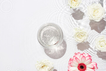 Jar of hydrating gel and flowers.
