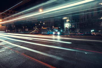 Cool long exposure cars traffic light trails, night view of the city of Rome
