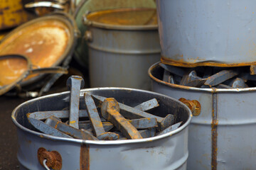 buckets of large nails for railroad track metal rusty heavy tools industrial equipment