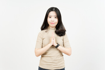 Obraz premium Fold Hands and Apologize, Say Sorry Of Beautiful Asian Woman Isolated On White Background