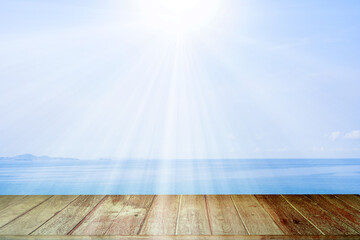 Wood texture Table Against Seascape And Sun rays 